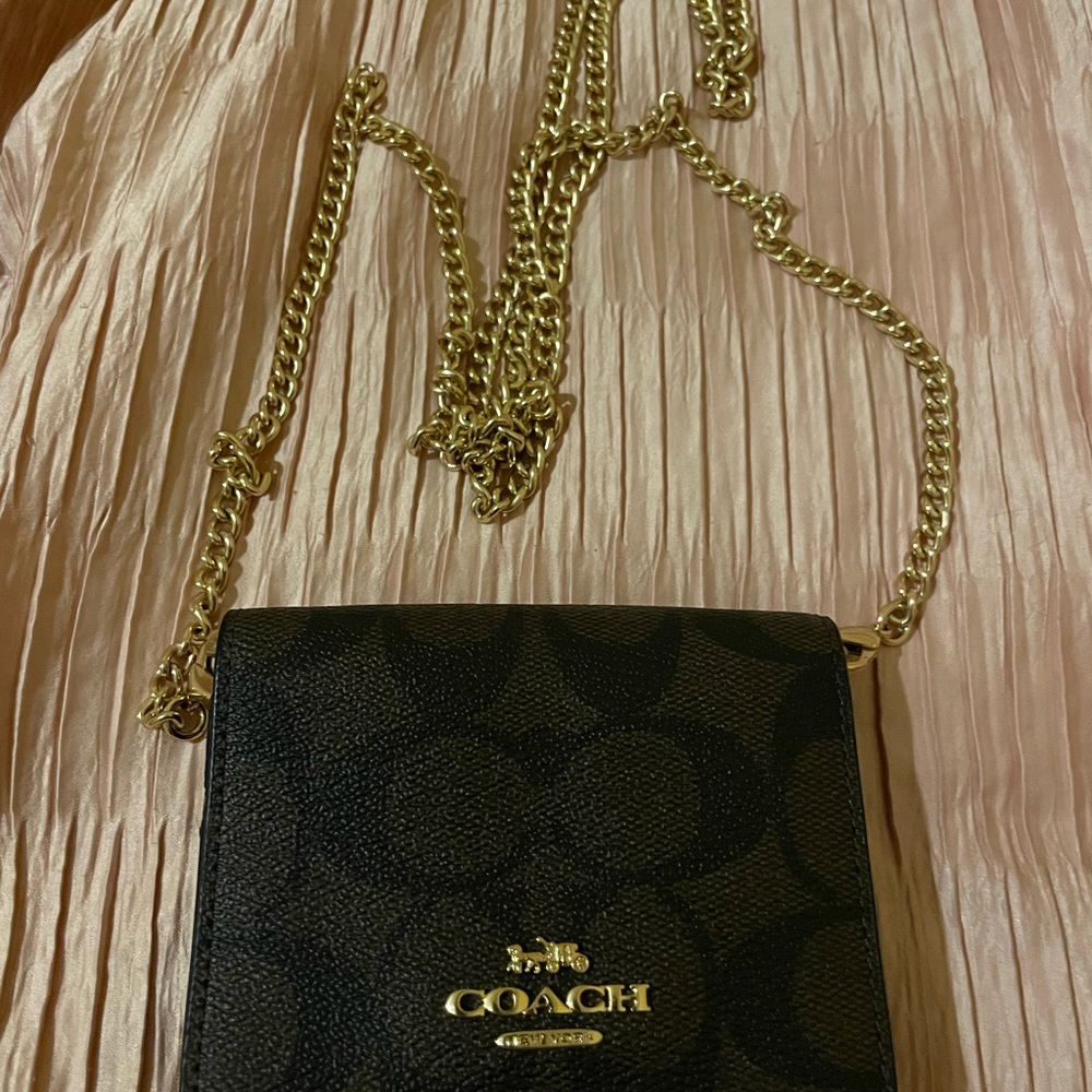 Coach Black and Gold Crossbody Bag with Signature Design